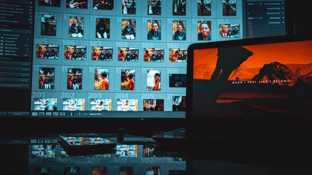 A developer's screen displays lines of code in a dimly-lit home office.